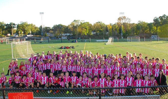 From mybergen.com: Members of the Wyckoff Torpedoes Soccer Club pose in their pink and white uniform jerseys with Chelsea Beecher, Development Director Susan G. Komen, New Jersey & Pennsylvania (far right). The club donated $2,725 dollars to Susan G. Komen, and wore the pink and white striped jerseys on game days throughout the month of October to support breast cancer awareness.